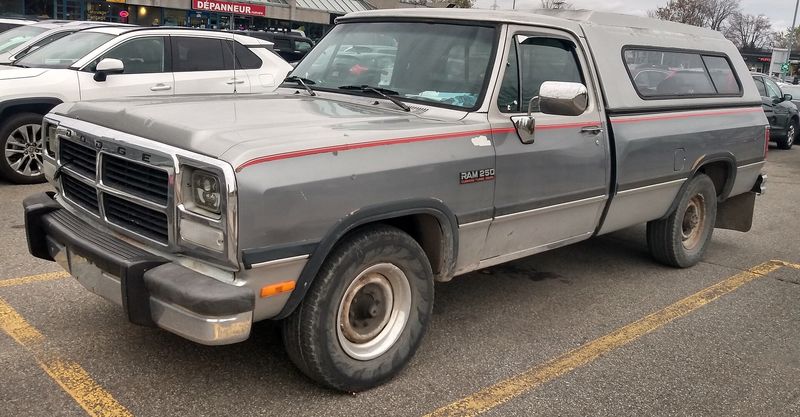 Two-tone grey 1991-1993 Dodge Ram 250 Cummins Turbodiesel regular cab in a parking lot