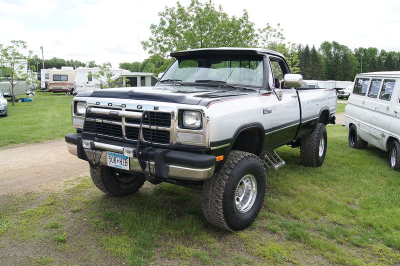 Lifted two-tone 1991 Dodge Power Ram W150 at a Mopar show